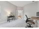 Cozy home office with gray walls, plush carpeting, and French doors that open up to the living room at 10725 Grindstone Dr, Fishers, IN 46037