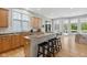 Spacious kitchen with granite countertops, an island, and an adjacent breakfast nook with outdoor access at 10725 Grindstone Dr, Fishers, IN 46037