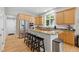 Modern kitchen featuring stainless steel appliances, granite countertops, and an island with bar seating at 10725 Grindstone Dr, Fishers, IN 46037