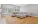 Bright living room features hardwood floors and comfortable sectional at 10725 Grindstone Dr, Fishers, IN 46037