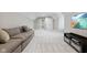 Spacious living room with neutral tones, plush carpeting, comfortable seating, and large tv at 10725 Grindstone Dr, Fishers, IN 46037