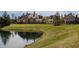 Beautiful backyard featuring a brick home, scenic pond and expansive green space at , Carmel, IN 46032