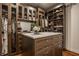 Custom walk-in closet boasts ample storage with built-in shelving, cabinets, drawers, and a center island at , Carmel, IN 46032