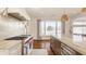 Open kitchen with premium range and hood, marble countertops, and ample natural light at , Carmel, IN 46032