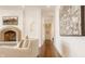 Bright living area with fireplace, hardwood floors, and elegant artwork at , Carmel, IN 46032