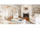 Elegant living room with a fireplace, marble coffee table, and stylish decor at , Carmel, IN 46032