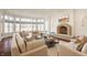 Cozy living room with a fireplace, large windows, and comfortable seating at , Carmel, IN 46032