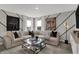Inviting living room with sectional sofa, stylish decor, and sun-filled windows at 11571 Aubrey Ln, Fishers, IN 46040