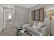 Cozy sitting room with comfortable couch, stylish decor, and relaxing atmosphere at 11571 Aubrey Ln, Fishers, IN 46040