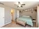 Bedroom showcases neutral colors, a ceiling fan, and a convenient en-suite bathroom nearby at 12929 Shandon Ln, Fishers, IN 46038