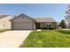 Charming single-story home with brick accents, a two-car garage, and well-kept front lawn at 12929 Shandon Ln, Fishers, IN 46038