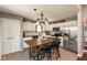 Kitchen with stainless steel appliances, white cabinets, wood countertops, tile backsplash, and center table at 12929 Shandon Ln, Fishers, IN 46038