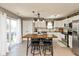 Open kitchen with stainless steel appliances, wood countertops, and ample counter space at 12929 Shandon Ln, Fishers, IN 46038