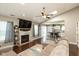 Open concept living room with vaulted ceilings, fireplace, and hardwood floors flows into the eat-in kitchen at 12929 Shandon Ln, Fishers, IN 46038