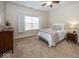 Bedroom featuring neutral walls, carpet, and natural light from a window at 14014 Keams Dr, Fishers, IN 46038