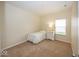 Cozy bedroom with a patterned bedspread, carpet flooring, and natural light at 14014 Keams Dr, Fishers, IN 46038