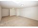 Spacious room with carpeted floors, white walls, and a built-in shelving unit at 14014 Keams Dr, Fishers, IN 46038