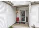 Inviting front porch with a chair adjacent to the door with house number listed on the trim at 14014 Keams Dr, Fishers, IN 46038