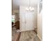 Bright entryway featuring carpet flooring, a white front door, and stairs leading to the upper level at 14014 Keams Dr, Fishers, IN 46038