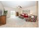 Comfortable living room with a ceiling fan, and sliding glass door leading to a backyard at 14014 Keams Dr, Fishers, IN 46038