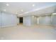 Large finished basement area, perfect for recreation or entertaining, with neutral carpet at 14339 Jeremy Dr, Carmel, IN 46033