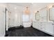 Modern bathroom featuring a glass shower, soaking tub, and vanity with ample storage at 14339 Jeremy Dr, Carmel, IN 46033