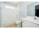 Bright bathroom with white tile, featuring a combined shower and tub, and a vanity at 14339 Jeremy Dr, Carmel, IN 46033