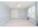 Light-filled bedroom with neutral carpet and a window with sheer curtains, cozy and inviting at 14339 Jeremy Dr, Carmel, IN 46033