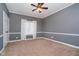 Cozy bedroom with a ceiling fan, neutral carpet, and a window that provide natural light at 14339 Jeremy Dr, Carmel, IN 46033