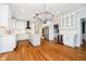 Spacious kitchen with white cabinetry, stainless steel appliances, and hardwood floors at 14339 Jeremy Dr, Carmel, IN 46033