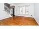 Bright living room with hardwood floors, staircase, and large window providing natural light at 14339 Jeremy Dr, Carmel, IN 46033