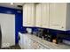 Kitchen featuring white cabinets, updated countertops and modern appliances at 1508 N Woodridge Ave, Muncie, IN 47304