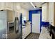 Bright kitchen with white cabinetry, stainless steel appliances, and stylish countertops at 1508 N Woodridge Ave, Muncie, IN 47304
