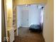 The living room features carpet, a white door, and a futon near the window, creating a relaxed space at 1508 N Woodridge Ave, Muncie, IN 47304