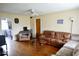 Comfortable living room with hardwood floors, plenty of seating, and natural light at 1508 N Woodridge Ave, Muncie, IN 47304