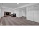 A carpeted basement with a fireplace, an armchair, and doors at 1847 Crystal Bay East Dr, Plainfield, IN 46168