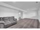 Finished basement area featuring a comfortable couch and neutral carpeting at 1847 Crystal Bay East Dr, Plainfield, IN 46168