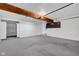 Spacious basement features painted floors and exposed wooden beams at 1847 Crystal Bay East Dr, Plainfield, IN 46168