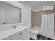 Bathroom with white vanity, matching toilet and tub/shower with curtain at 1847 Crystal Bay East Dr, Plainfield, IN 46168