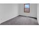 Empty bedroom with neutral carpet, white walls, and a single window at 1847 Crystal Bay East Dr, Plainfield, IN 46168