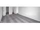 A large empty bedroom with neutral walls and carpet with multiple entry doors at 1847 Crystal Bay East Dr, Plainfield, IN 46168