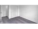 An empty bedroom with gray carpet and a closet with sliding doors at 1847 Crystal Bay East Dr, Plainfield, IN 46168