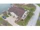 Lovely lakeside home with a deck, attached garage, well-kept lawn, and beautiful landscaping at 1847 Crystal Bay East Dr, Plainfield, IN 46168