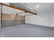 An empty garage with a sealed floor and garage door at 1847 Crystal Bay East Dr, Plainfield, IN 46168