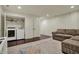 Spacious basement area featuring laundry machines, storage, and a comfortable sofa with a decorative rug at 2037 Rhettsbury St, Carmel, IN 46032