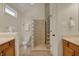 Bathroom with double sink vanities, modern toilet, and modern glass block shower at 2037 Rhettsbury St, Carmel, IN 46032