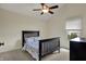 Bedroom featuring a bed, window view, and dresser at 2037 Rhettsbury St, Carmel, IN 46032