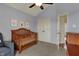 Bright Bedroom with a wooden crib, dresser, artwork, and double door closet at 2037 Rhettsbury St, Carmel, IN 46032