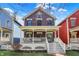 Charming two-story home with a welcoming front porch and colorful siding in a vibrant neighborhood at 2037 Rhettsbury St, Carmel, IN 46032