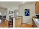 Open concept kitchen features granite counters, breakfast bar, and stainless steel appliances at 2037 Rhettsbury St, Carmel, IN 46032